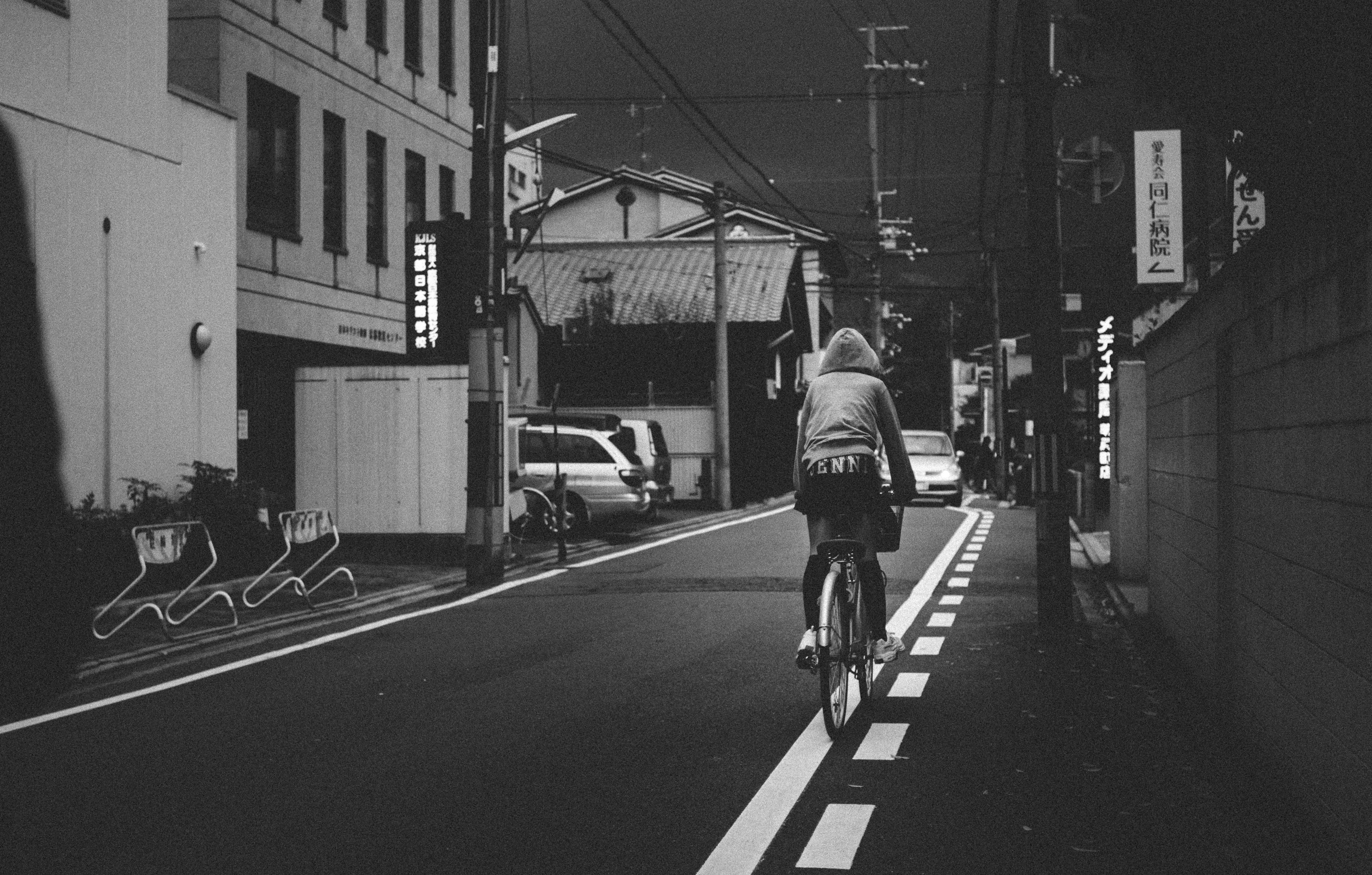 Image of a bike in a dark alley; black and white image